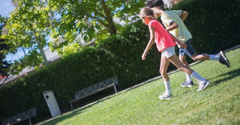 Belgrade Outdoor Activities - Kids Walking on the Grass Field