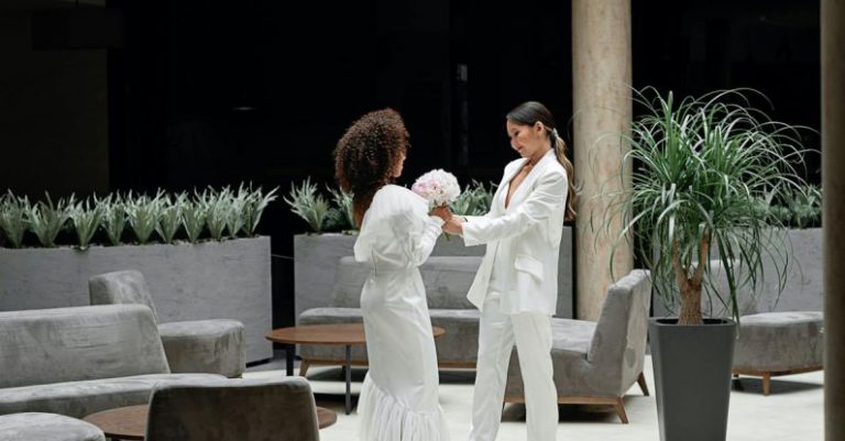 Wedding Hotels Belgrade - Man and Woman Kissing on White Floor