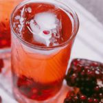 Serbian Food - Pomegranate juice and pomegranate slices on a white cloth