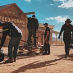 Film Scene Belgrade - four men standing outside Feed and Grain store
