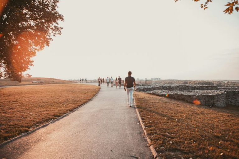 Belgrade Culture - couple walking on gray concrete road during daytime