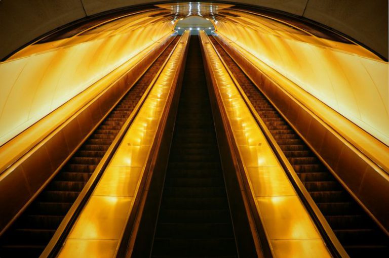 Belgrade Underground - brown and black escalator in a tunnel