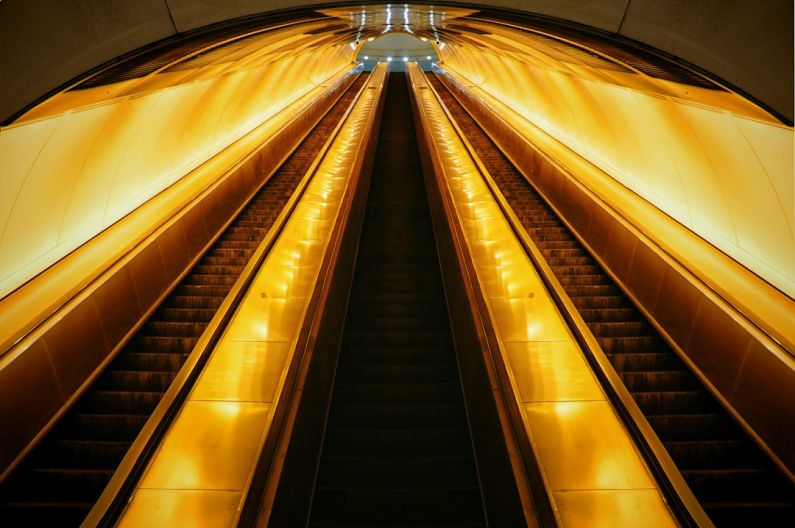 Belgrade Underground - brown and black escalator in a tunnel