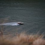Belgrade Rivers - white and black boat on sea during daytime