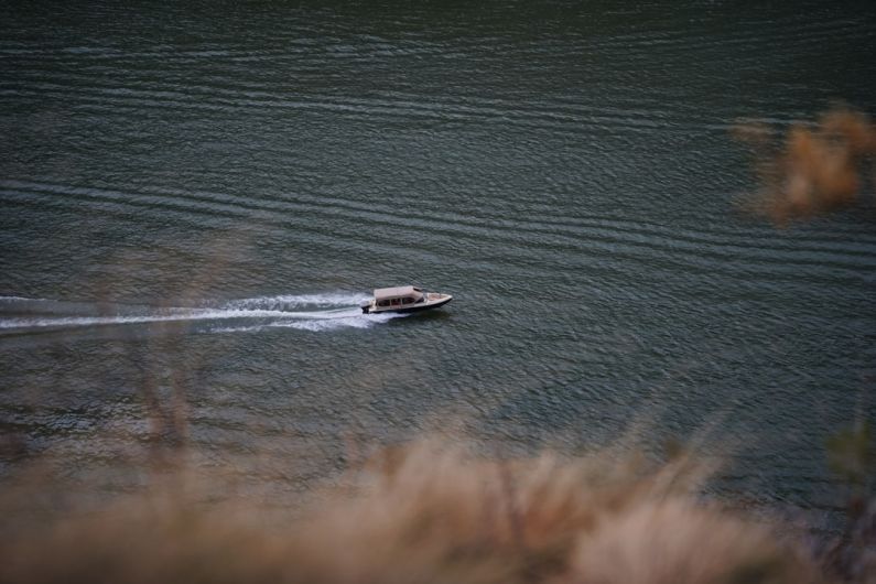 Belgrade Rivers - white and black boat on sea during daytime