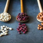 Serbian Food - brown wooden spoon with red and brown beans