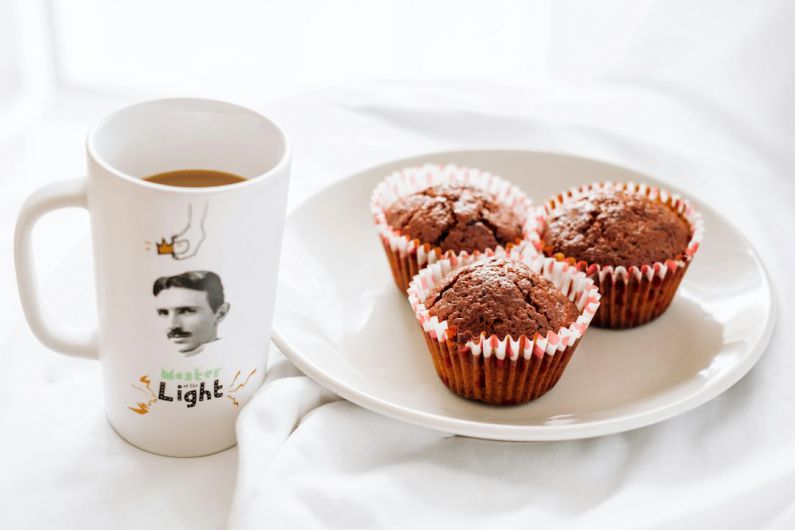 Belgrade Souvenirs - cupcakes on white ceramic plate beside white ceramic mug