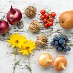 Belgrade Food Market - assorted vegetables, fruits, and flowers on white surface