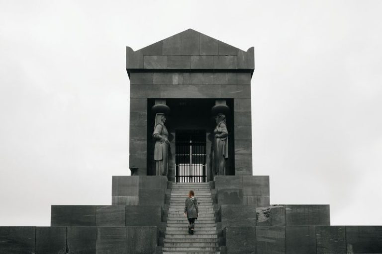 Avala Tower - 2 women standing in front of gray concrete building during daytime