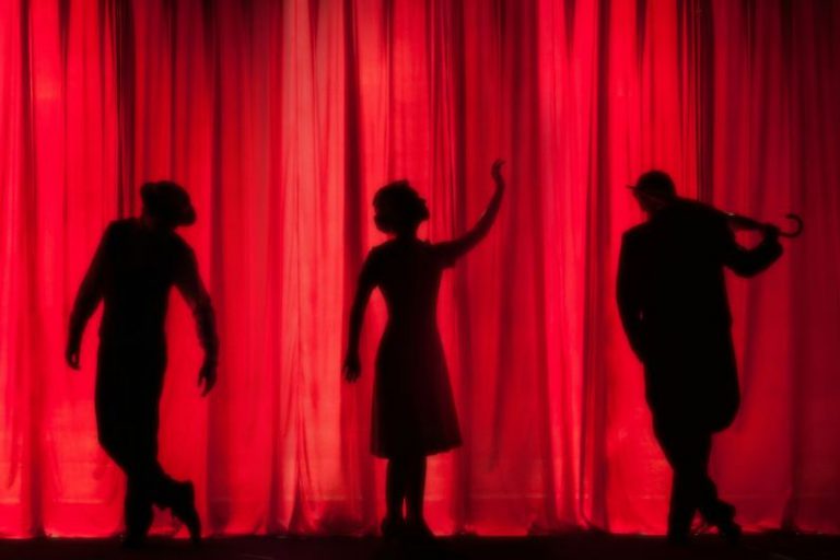 National Theatre Belgrade - silhouette of three performers on stage