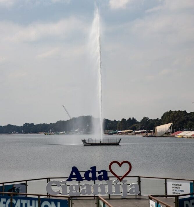 A scenic view of the fountain at Ada Ciganlija in Belgrade, Serbia during summer.