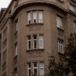 Beautiful historic building facade with ornate details in Belgrade, Serbia, showcasing urban architecture.