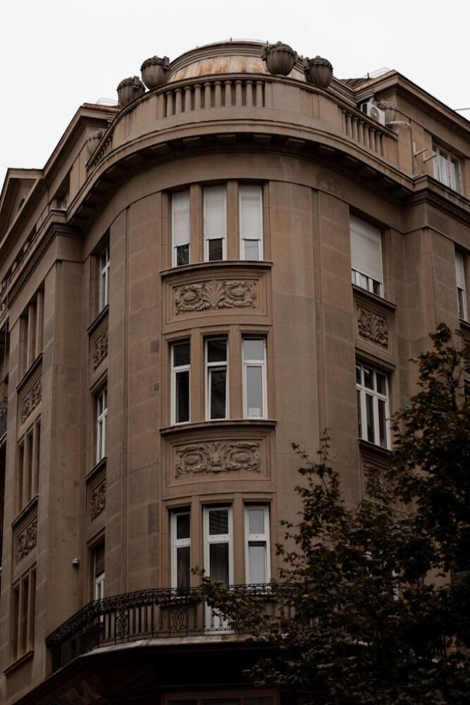 Beautiful historic building facade with ornate details in Belgrade, Serbia, showcasing urban architecture.