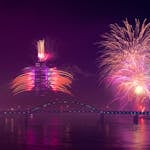 Colorful fireworks illuminate Ada Bridge in Belgrade, creating a spectacular night scene over the river.