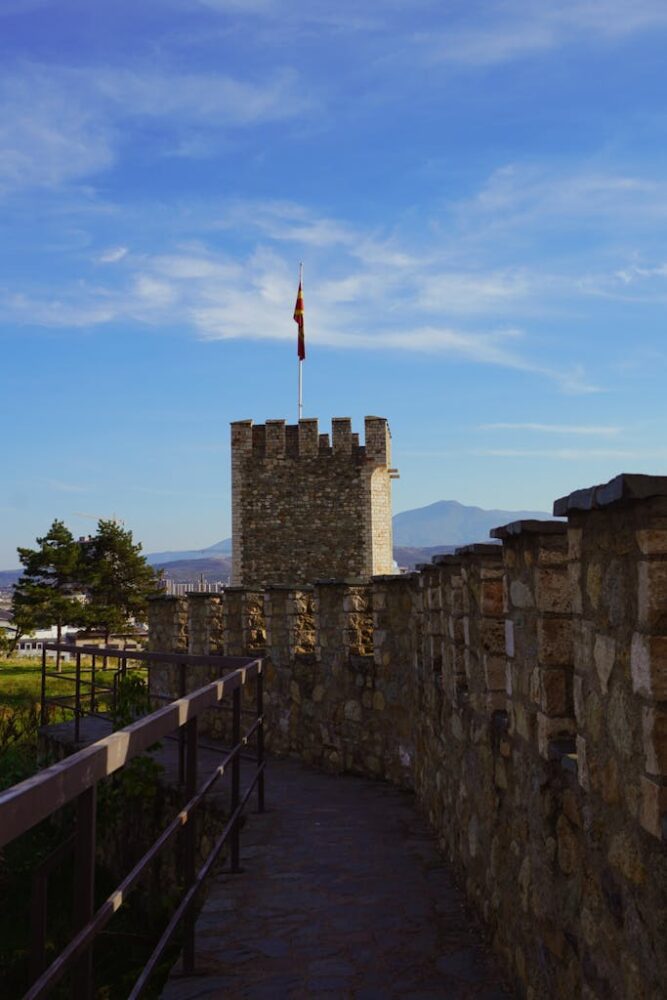 Historic tower and wall at Kalemegdan Fortress in Belgrade, under a blue sky.
